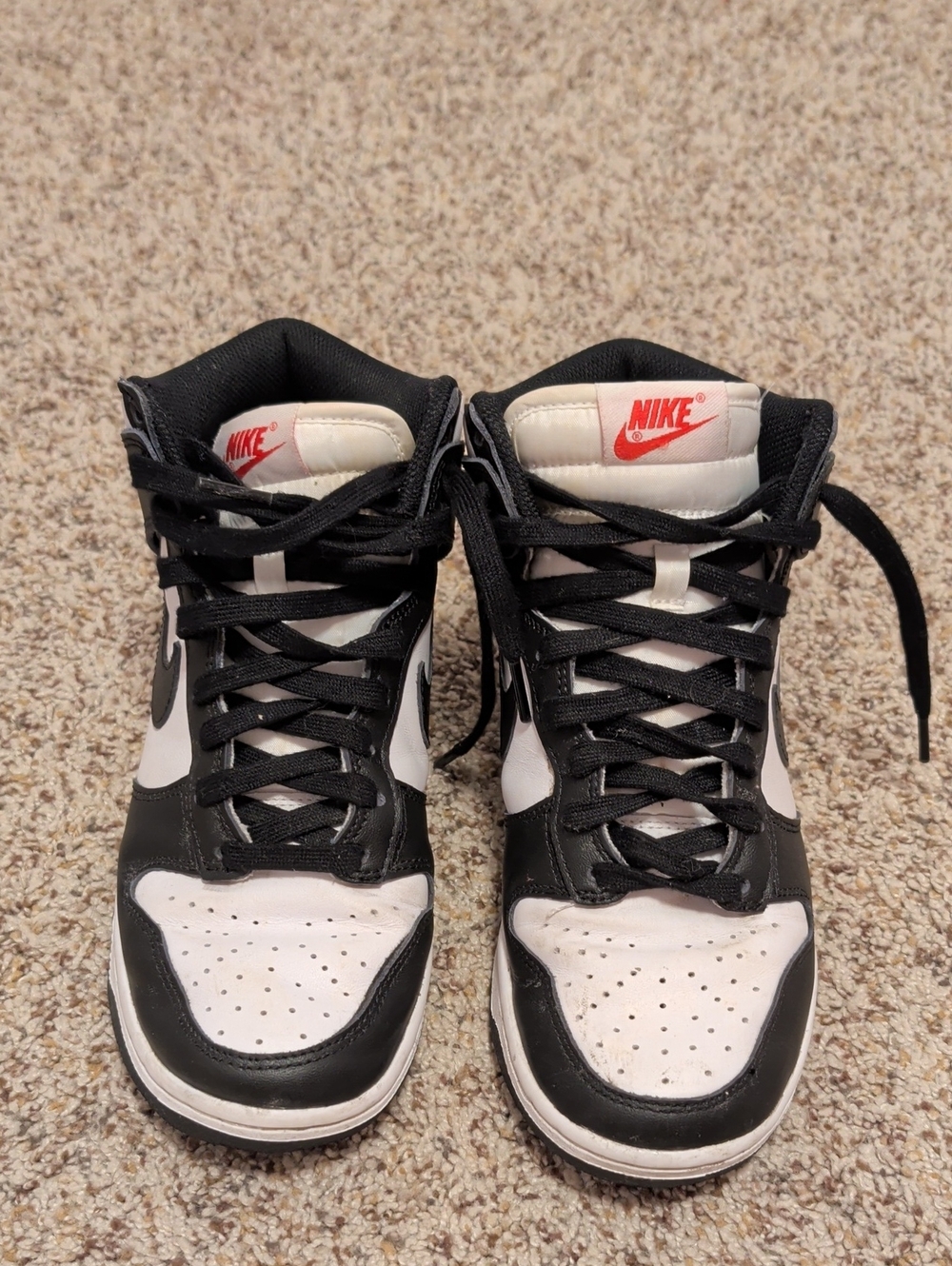Nike Black and White High-Top Sneakers with Red Logo